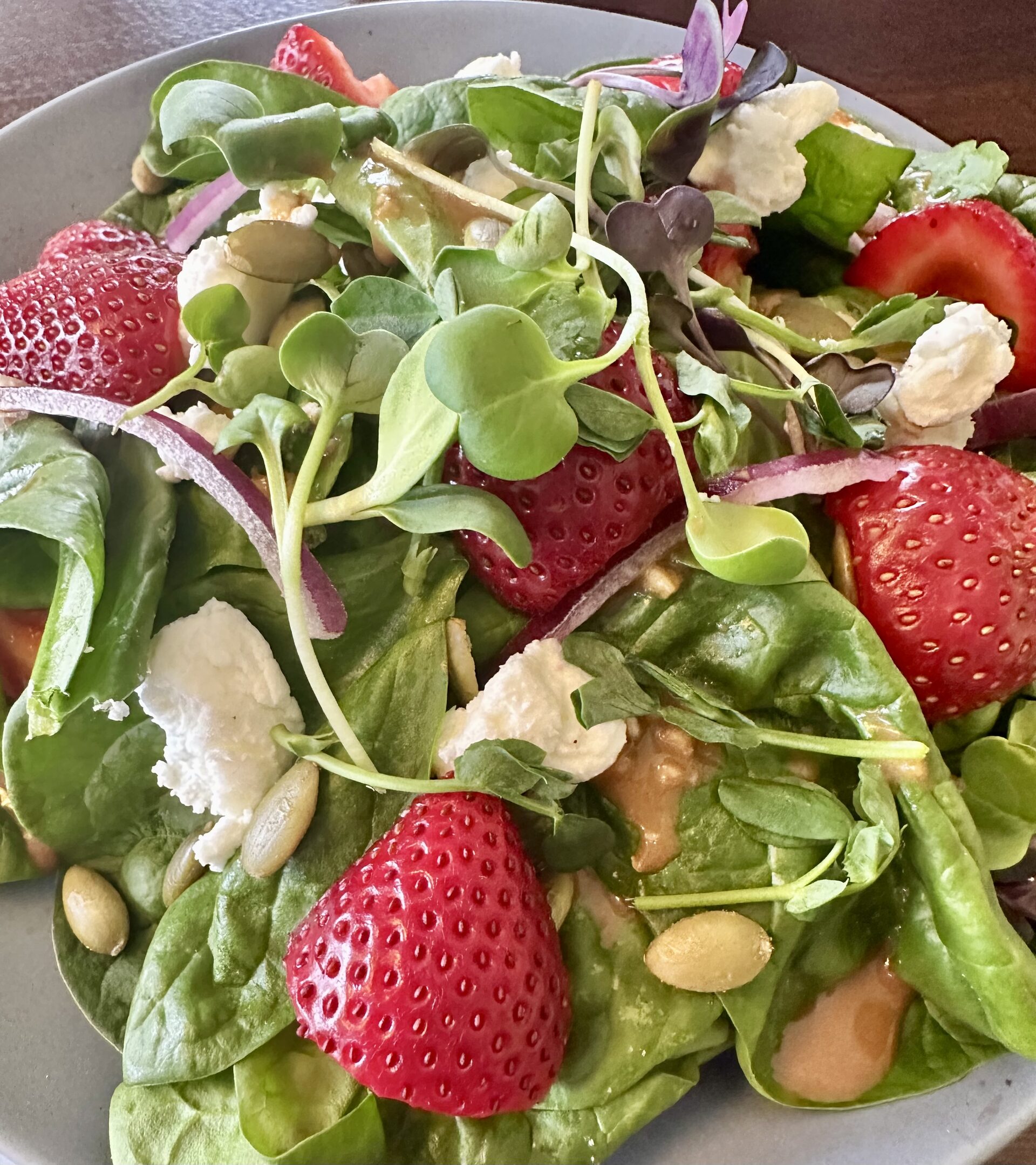 A freshly made strawberry and spinach salad